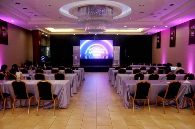 The main hall before the doors opened, lit in the MoxieLink violet.