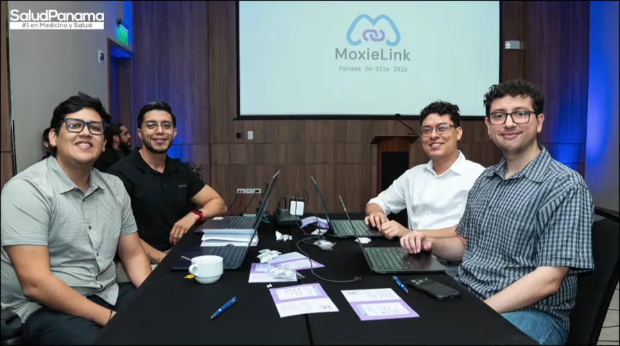 A team of four sits together, the MoxieLink Panama On-Site 2026 slide projected behind them.