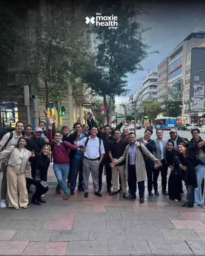 The Moxie team together on a Madrid street.