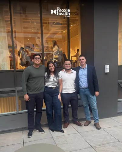 Four members of the Moxie team outside the office.